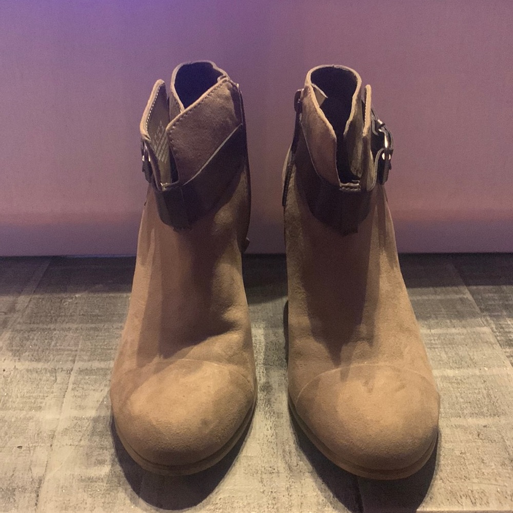 Carlos Santana high heeled boots.